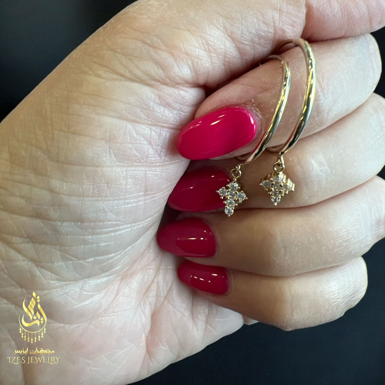 women earrings feature simple and elegant gold hoops from which a small cross-shaped - Image 8