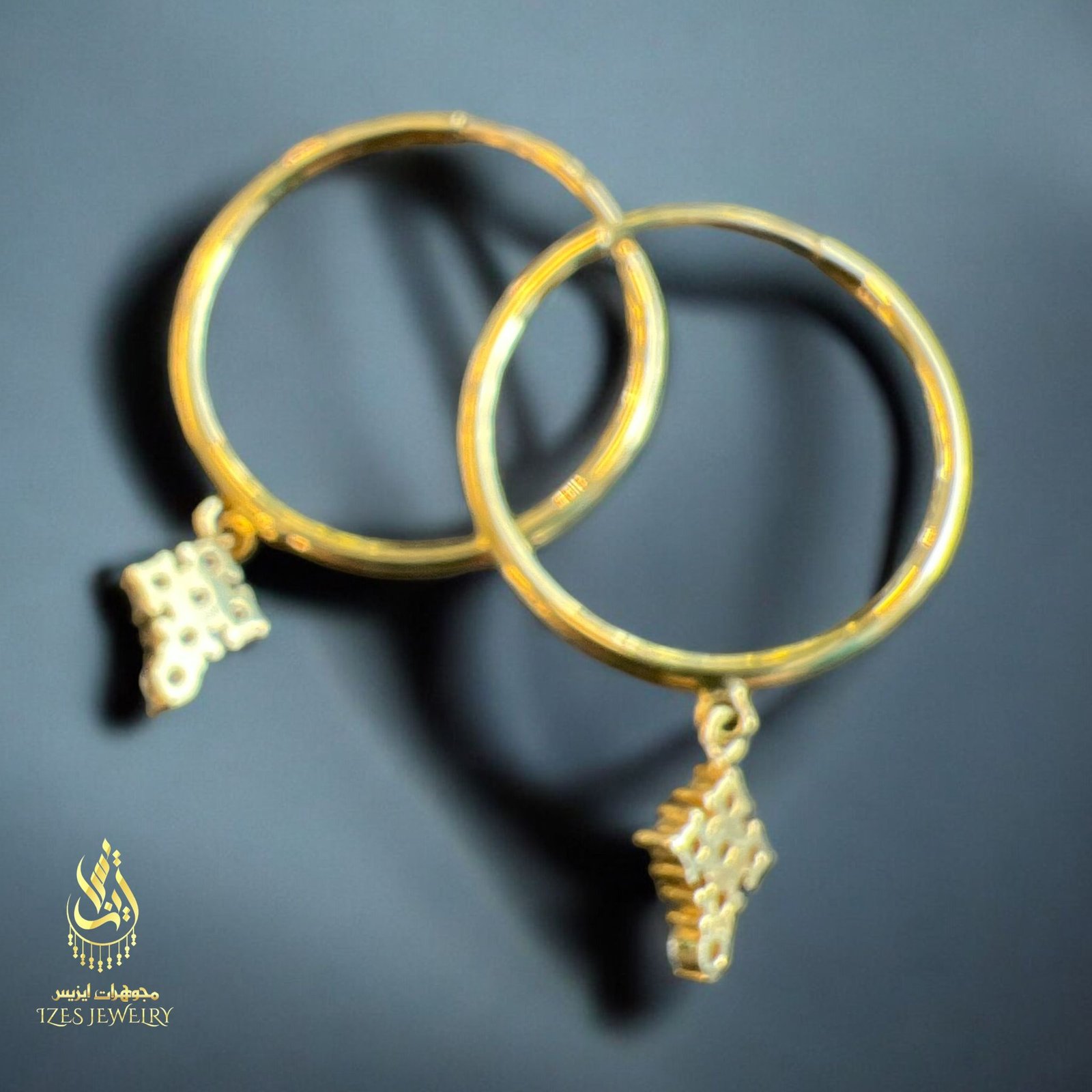 women earrings feature simple and elegant gold hoops from which a small cross-shaped - Image 3