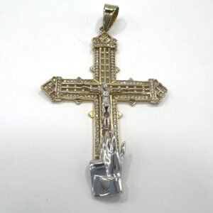 14K yellow gold cross pendant with bold design and hand cuff detail.