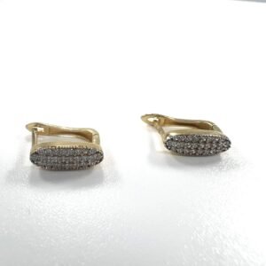 Elegant 14K yellow gold plug earrings with delicate design and sparkling zircon