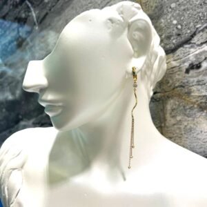 Elegant long 14K yellow gold earrings, graceful and charming.