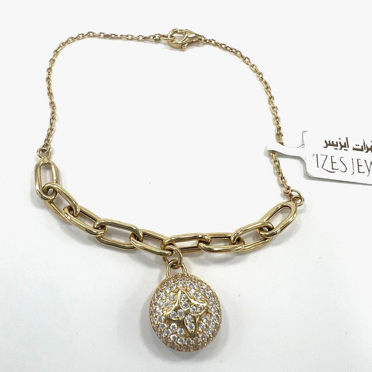 Beautiful 14K yellow gold bracelet with a chain & zircon decorated circle charm