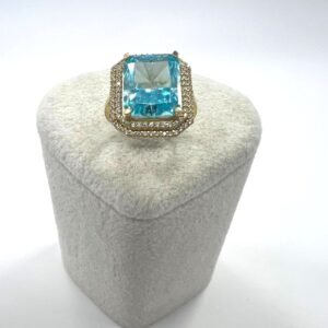 A luxurious 14K yellow gold ring exudes royal elegance large square blue stone