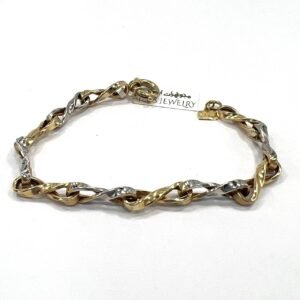 14K yellow and white gold bracelet with a beautiful infinity-inspired design.