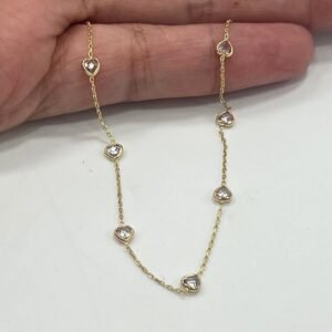 14K yellow gold bracelet with white heart-shaped stones, elegant design