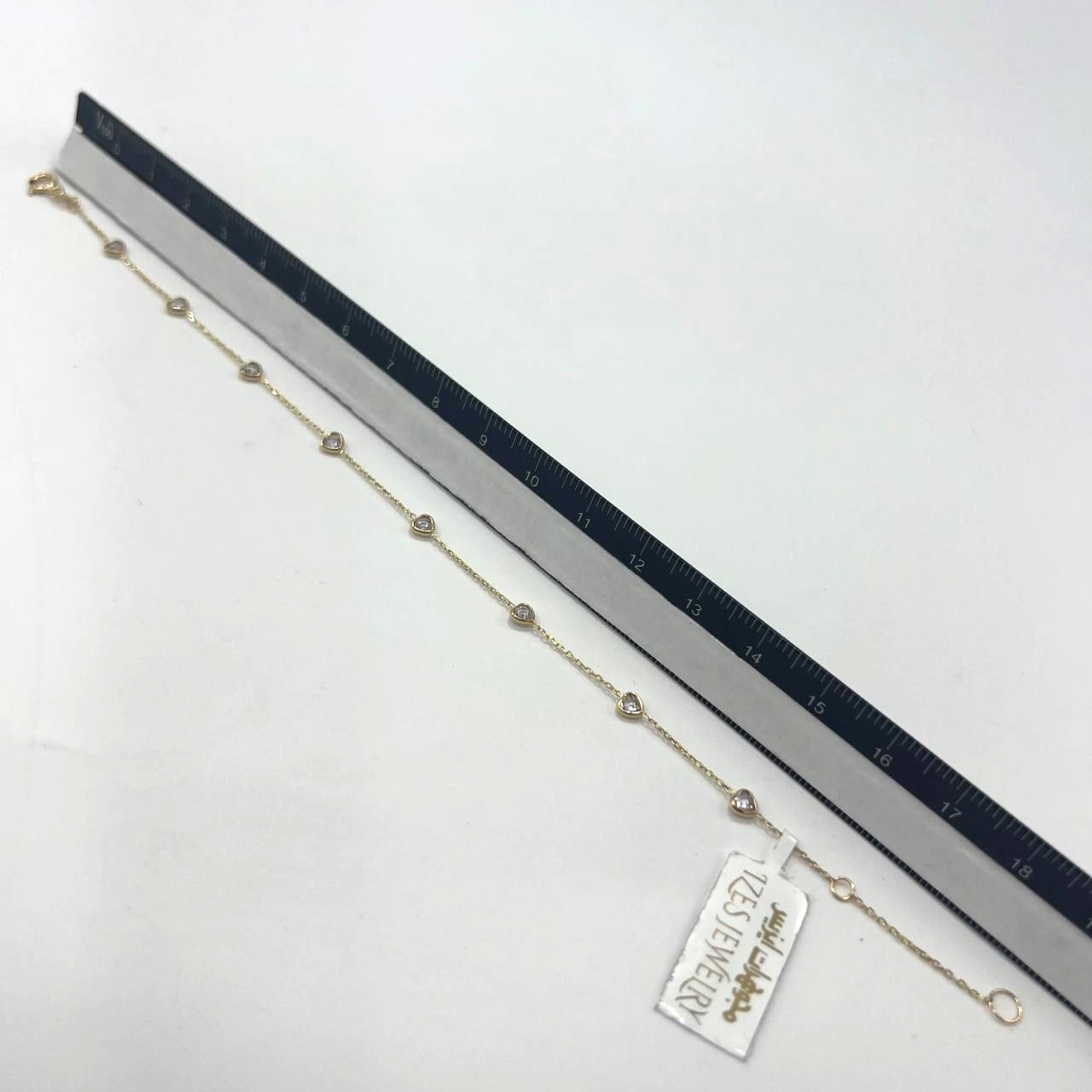 14K yellow gold bracelet with white heart-shaped stones, elegant design - Image 9